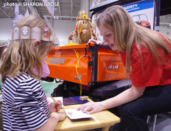 volunteer and girl at Royal Fair